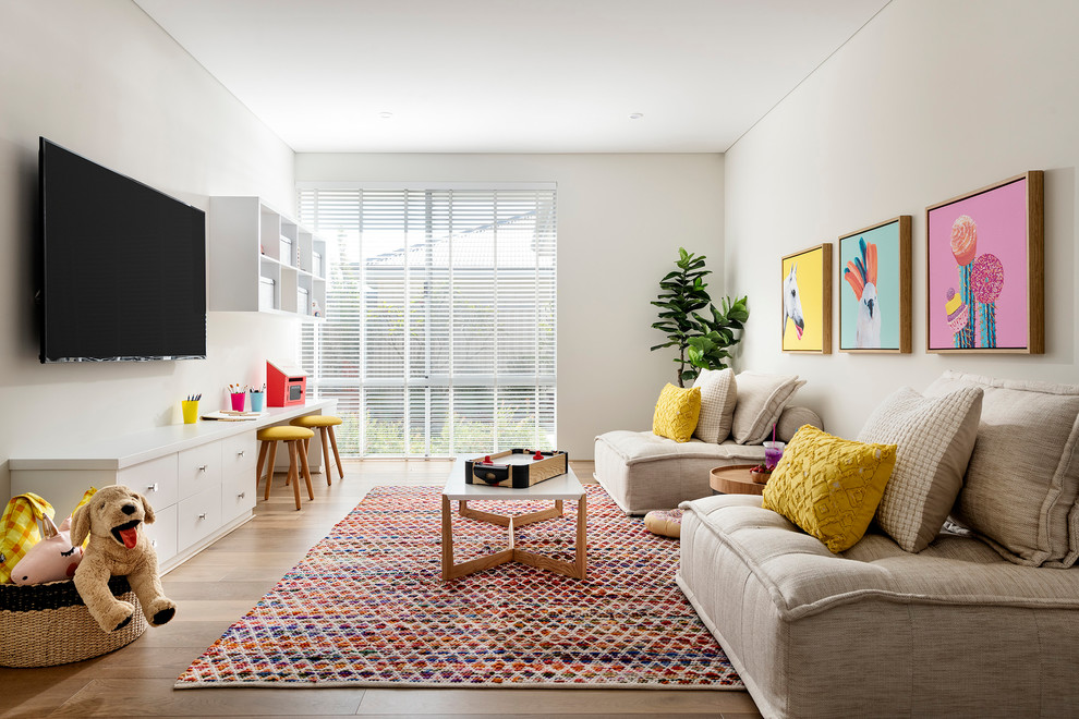 Inspiration for a contemporary gender-neutral kids' playroom for kids 4-10 years old in Perth with white walls, medium hardwood floors and brown floor.