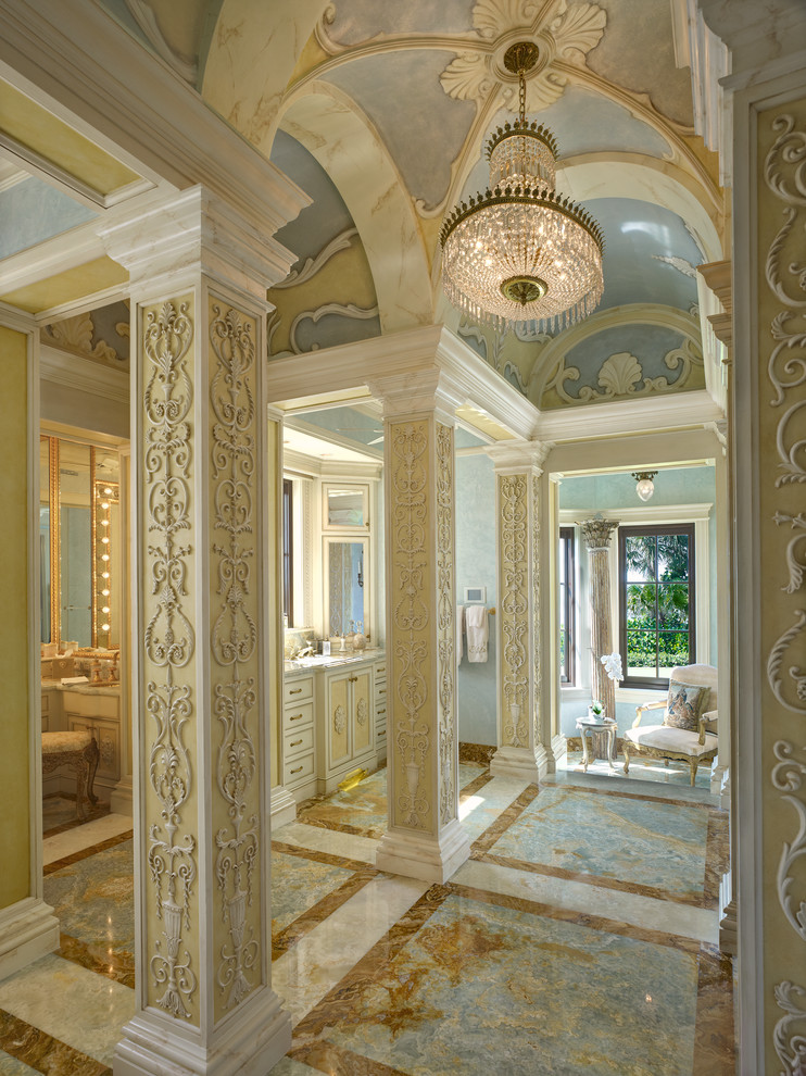 Expansive mediterranean master bathroom in Miami with recessed-panel cabinets, yellow cabinets and multi-coloured walls.