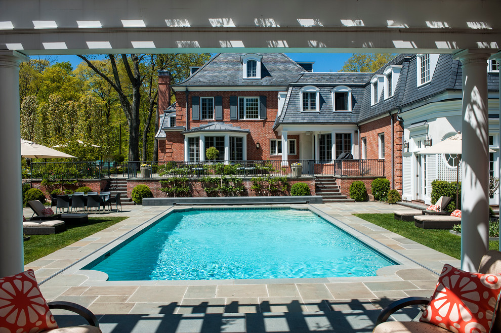 Inspiration for a traditional backyard pool in New York.