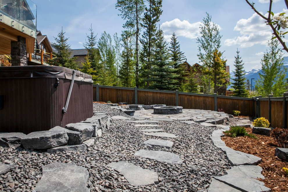Example of a mountain style home design design in Calgary