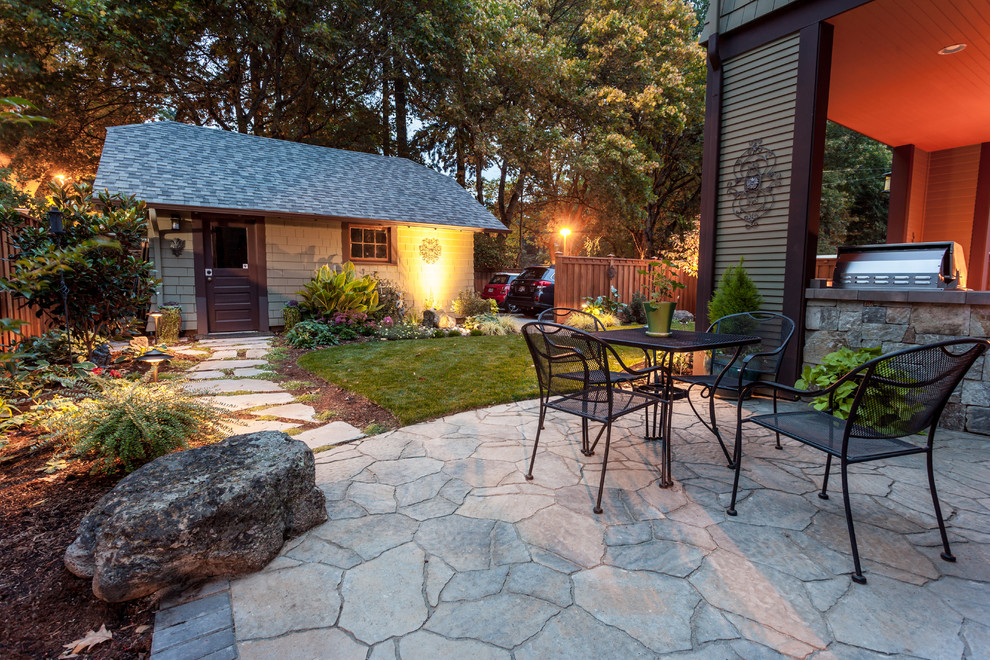 Photo of a mid-sized arts and crafts backyard patio in Portland with concrete pavers.