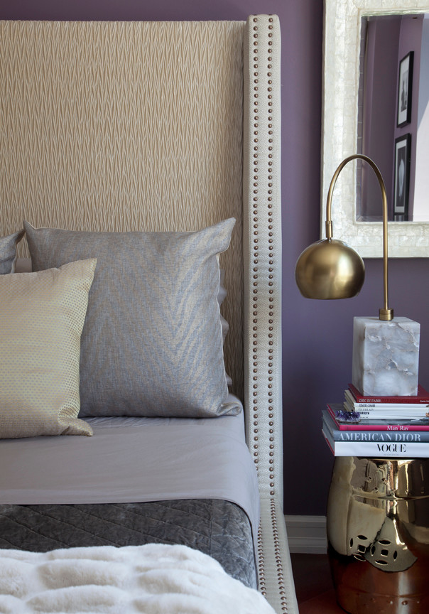 Inspiration for a mid-sized traditional master bedroom in New York with purple walls.
