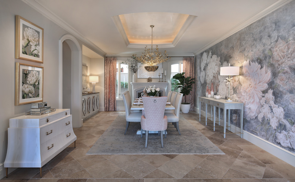 Huge transitional travertine floor and brown floor enclosed dining room photo in Orange County with multicolored walls, a standard fireplace and a stone fireplace