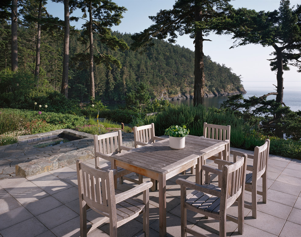 Design ideas for a beach style backyard patio in Seattle with no cover.