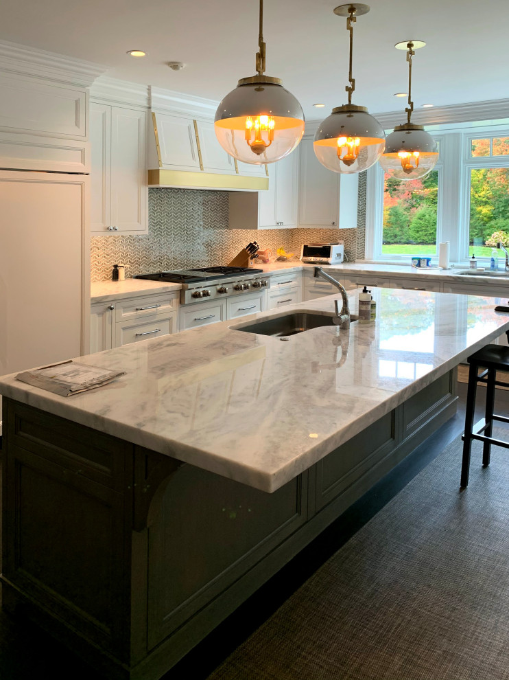 Example of a large transitional dark wood floor kitchen design in Boston with a drop-in sink, recessed-panel cabinets, granite countertops, mosaic tile backsplash, white appliances, an island and gray countertops