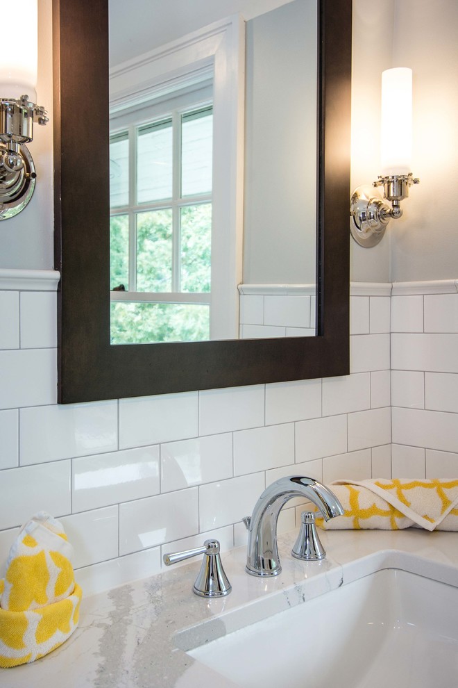 Photo of a small traditional bathroom in Other with dark wood cabinets, a shower/bathtub combo, white tile, subway tile, white walls, ceramic floors and a shower curtain.