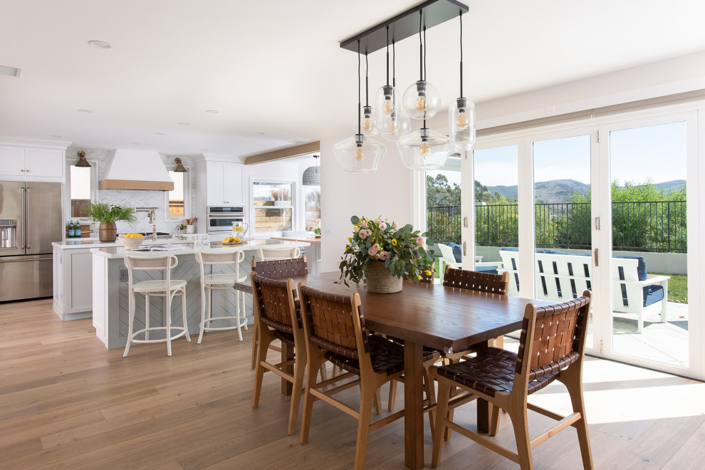 Design ideas for a farmhouse dining room in Orange County.