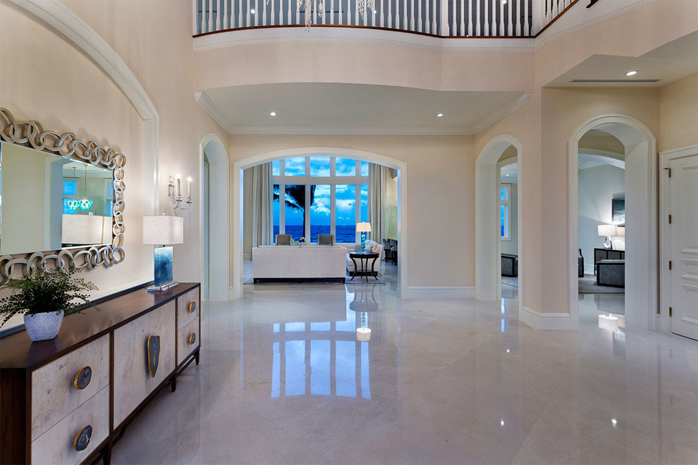 Photo of a mid-sized transitional foyer in Miami with a double front door, beige walls, marble floors, a dark wood front door and multi-coloured floor.