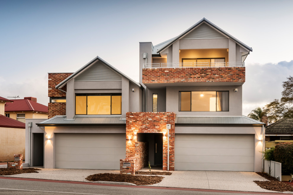 This is an example of a contemporary three-storey duplex exterior in Perth with mixed siding, a gable roof, a metal roof and a grey roof.