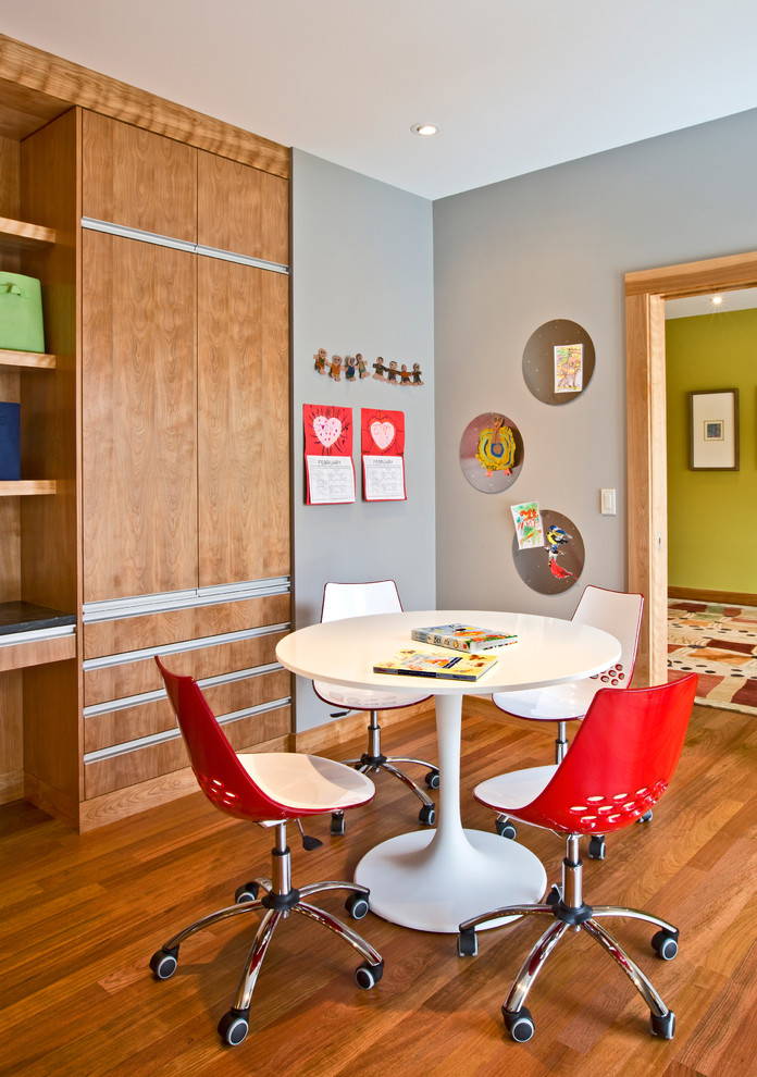 This is an example of a contemporary kids' study room in Minneapolis with grey walls.