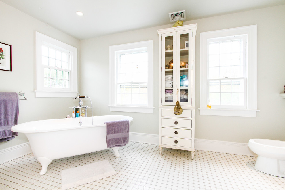 Large traditional master bathroom in Other with a freestanding tub.