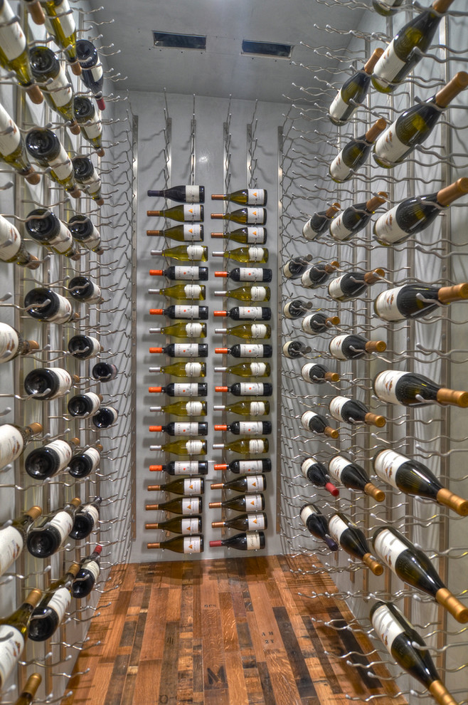 Photo of a contemporary wine cellar in Orange County.