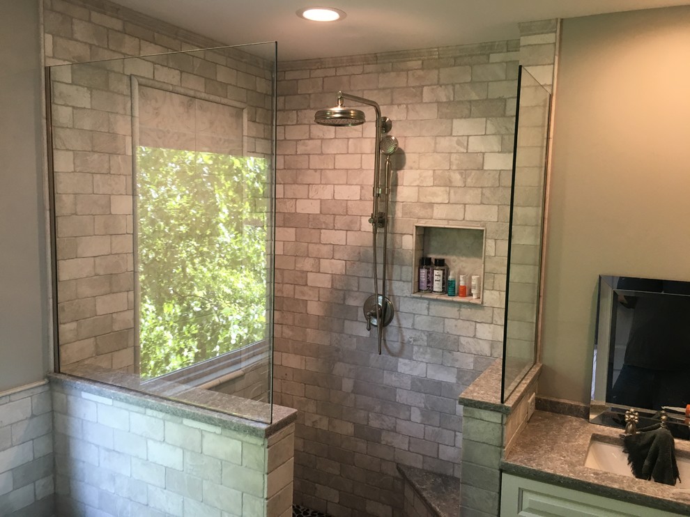 Inspiration for a mid-sized transitional 3/4 bathroom in Chicago with raised-panel cabinets, white cabinets, a corner shower, gray tile, stone tile, grey walls, an undermount sink, an open shower and grey benchtops.