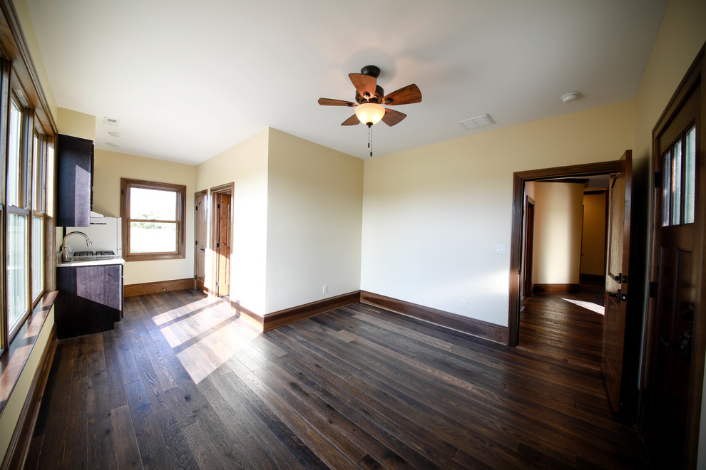 This is an example of an arts and crafts guest bedroom in Other with medium hardwood floors.