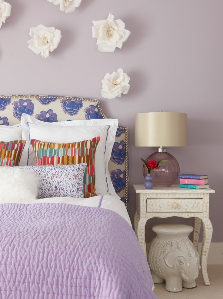 This is an example of a mid-sized traditional kids' bedroom for girls in Providence with purple walls and carpet.