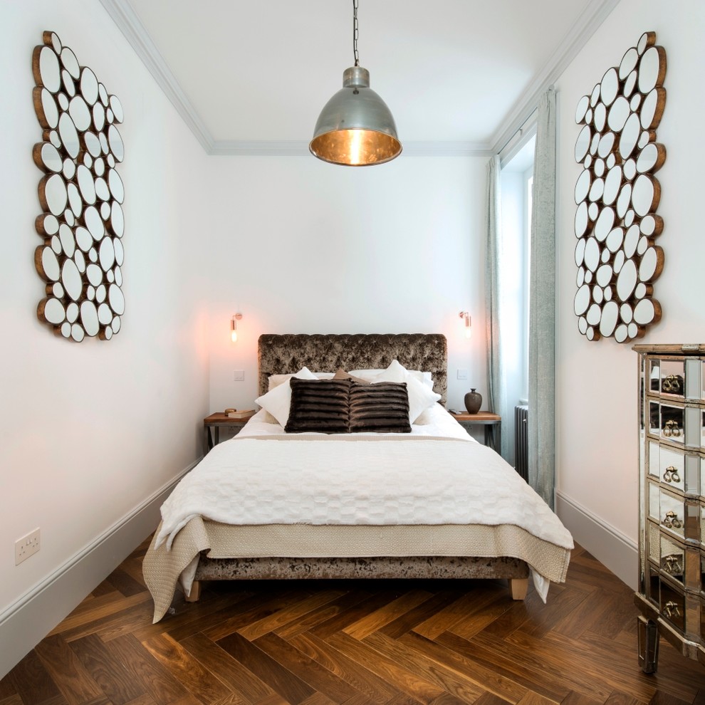 Photo of a mid-sized contemporary master bedroom in London with white walls, dark hardwood floors and brown floor.