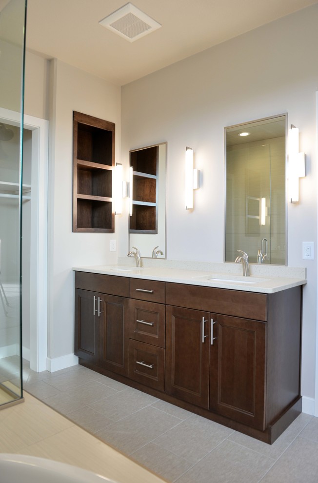 Example of a mid-sized transitional kids' ceramic tile bathroom design with an undermount sink, flat-panel cabinets, dark wood cabinets, quartz countertops and beige walls
