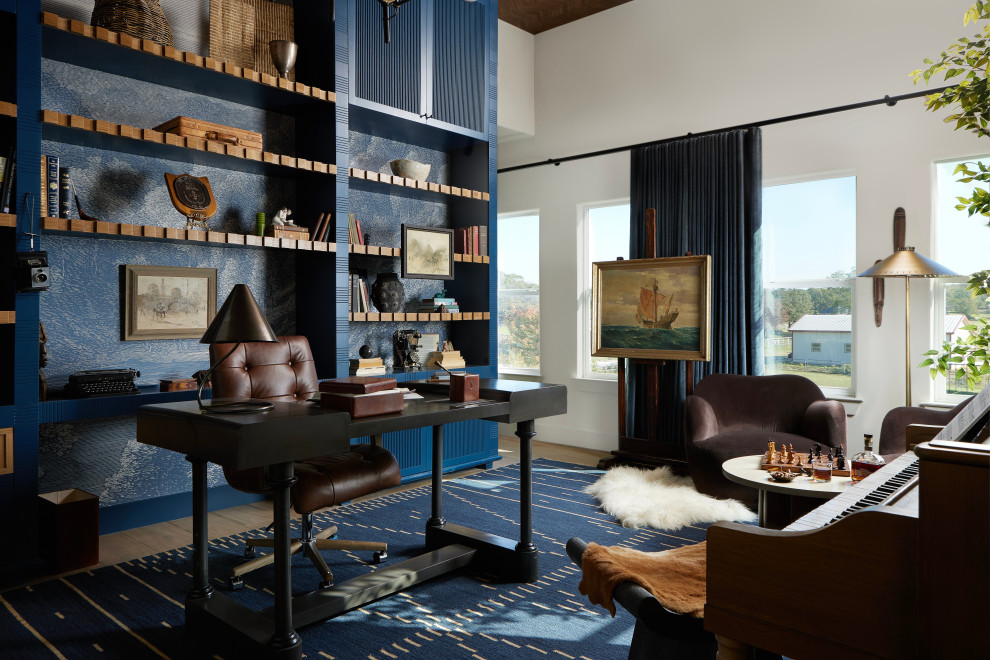 Barrel & Beam - One of the most unique spaces in the home is the piano library, where Alan spends a great deal of time reading and working. This sunlit corner of the house is being reimagined with custom millwork, with built-in shelves that will stretch across the entire wall. The craftsmanship of the shelving will be a focal point of the space, with intricate details and seamless integration into the room’s architecture. The design is not only functional but also visually striking, offering a sophisticated way to display books, keepsakes, and treasures while adding depth and elegance to the room.
The layout reflects both Alan’s daily routine and the family’s love for music, as the space also serves as a place for piano practice. The natural light streaming through the windows creates a serene environment, perfect for reading, reflection, or quiet moments. Complementing this warmth is a unique lighting design, which will highlight the millwork and cast a soft, inviting glow throughout the room. This one-of-a-kind lighting enhances the beauty of the built-ins, making the space feel both cozy and refined at any hour of the day.