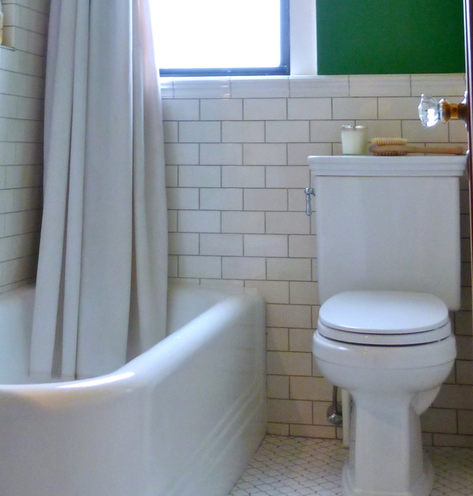Small country 3/4 bathroom in New York with a corner shower, a two-piece toilet, white tile, subway tile, green walls, ceramic floors, a pedestal sink, white floor and a shower curtain.