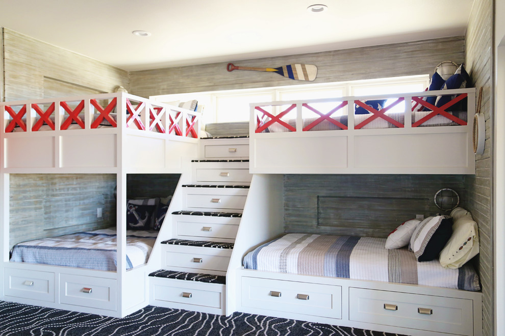 Photo of a large beach style gender-neutral kids' bedroom in Other with multi-coloured walls, carpet and black floor.
