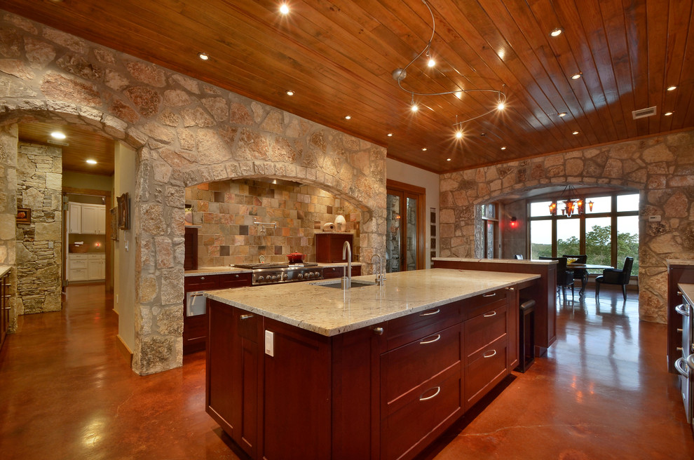 Eat-in kitchen - rustic eat-in kitchen idea in Austin with an undermount sink, shaker cabinets, medium tone wood cabinets, multicolored backsplash, mosaic tile backsplash and stainless steel appliances