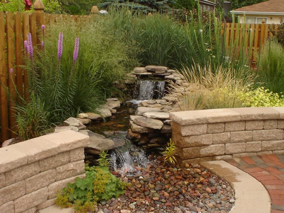 Inspiration for a mid-sized transitional red two-story brick landscaping in Chicago with a clipped gable roof.