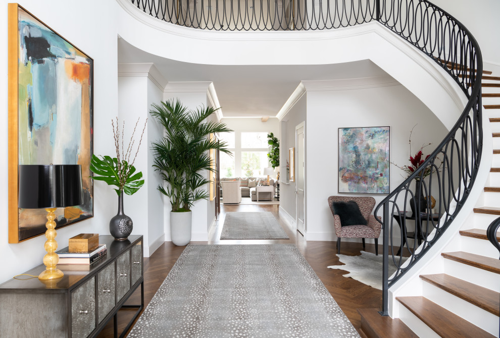 Inspiration for an expansive transitional foyer in Dallas with white walls, medium hardwood floors, a double front door, a metal front door and brown floor.