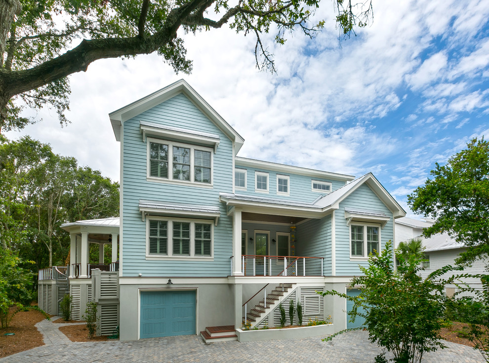 Inspiration for a large beach style three-storey blue exterior in Charleston with concrete fiberboard siding.
