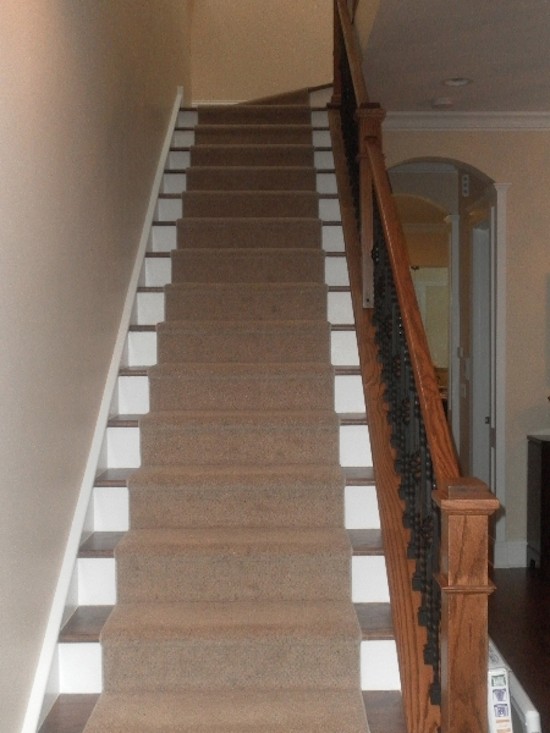 Staircase - transitional carpeted straight staircase idea in Chicago with painted risers