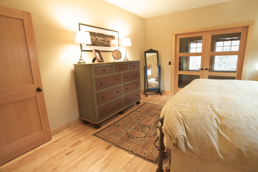 Design ideas for a mid-sized country master bedroom in Other with beige walls, bamboo floors and no fireplace.