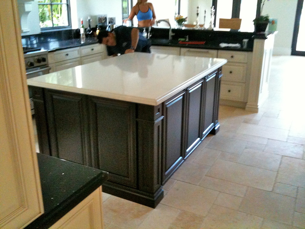 Example of a large transitional u-shaped ceramic tile and beige floor open concept kitchen design in Miami with a single-bowl sink, raised-panel cabinets, white cabinets, quartzite countertops, multicolored backsplash, stone tile backsplash, stainless steel appliances and an island