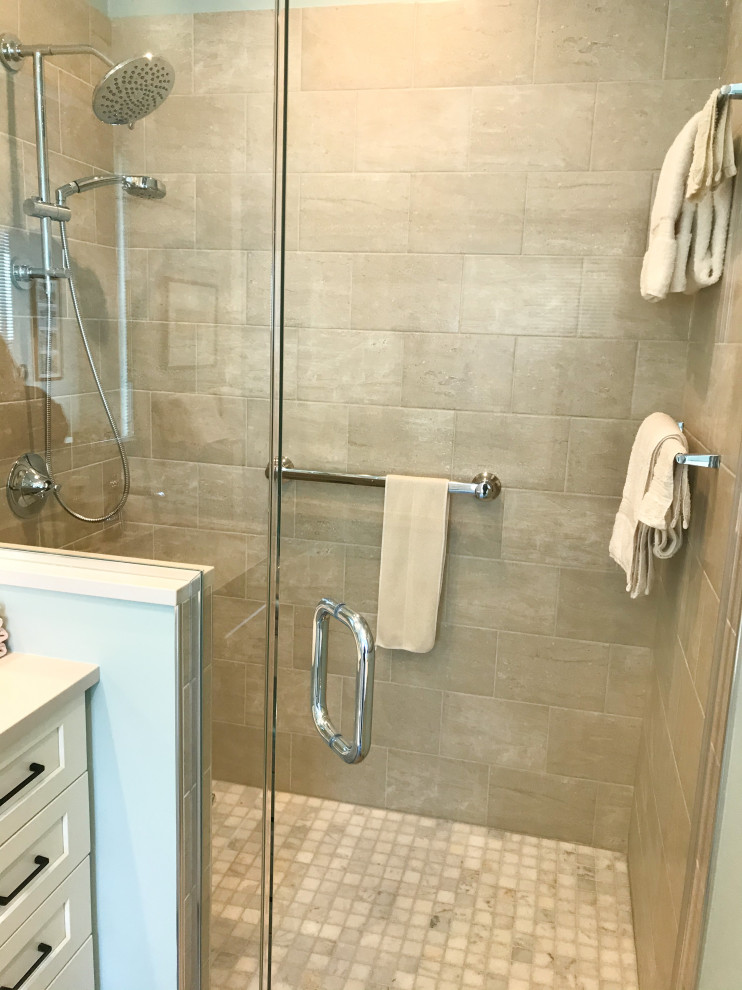 This is an example of a small transitional master bathroom in Chicago with shaker cabinets, white cabinets, a one-piece toilet, gray tile, ceramic tile, blue walls, porcelain floors, an undermount sink, engineered quartz benchtops, grey floor, a hinged shower door, white benchtops, a single vanity and a freestanding vanity.