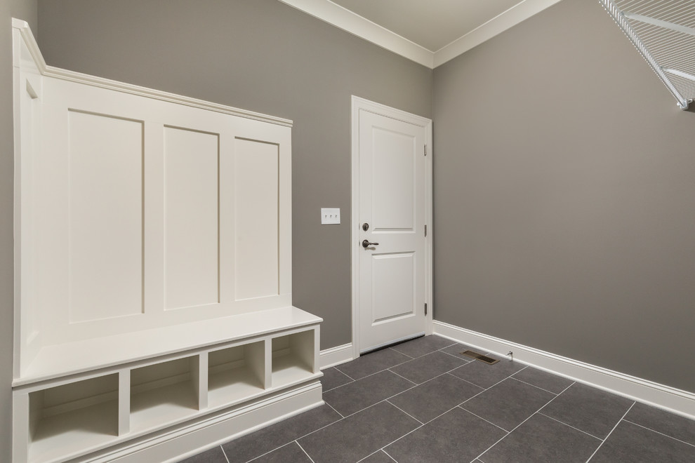Design ideas for a large transitional mudroom in Other with grey walls, porcelain floors, a single front door, a white front door and grey floor.