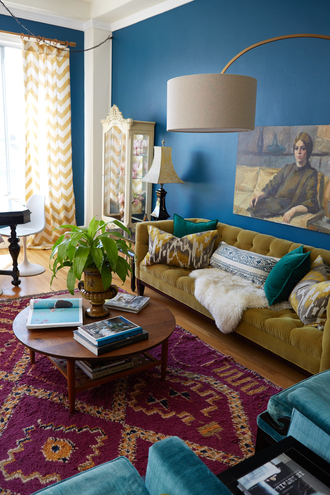 Photo of a small eclectic open concept living room in Boston with blue walls.