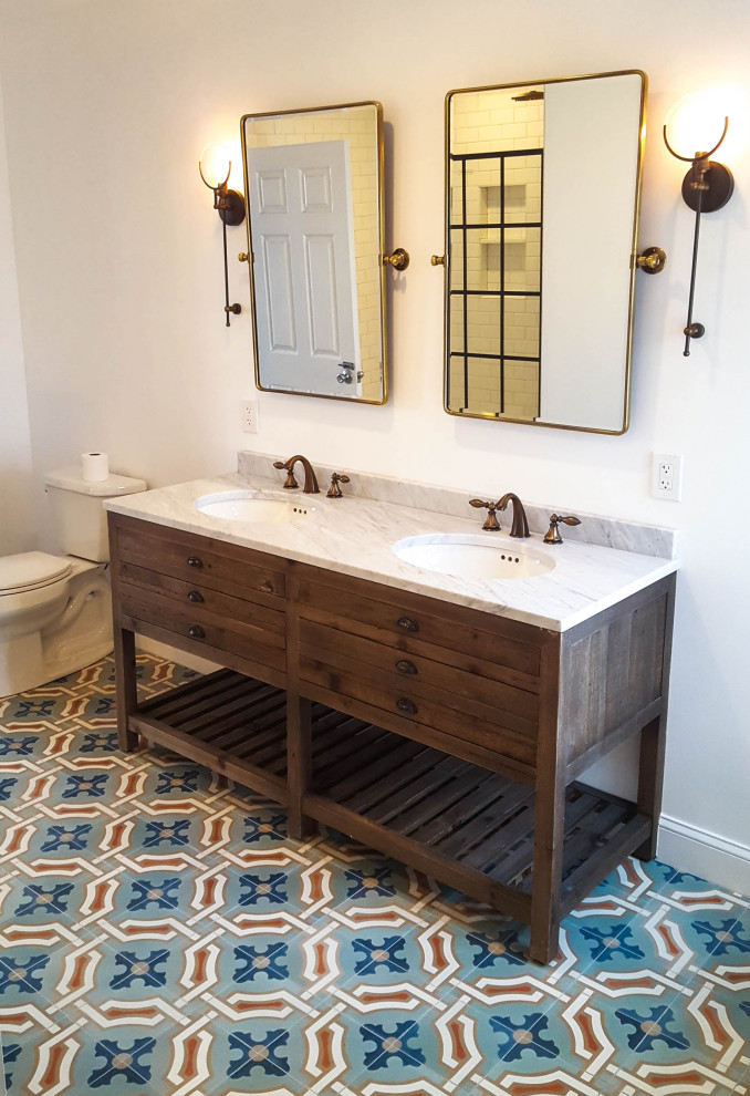 This is an example of a mid-sized contemporary master bathroom in Philadelphia with flat-panel cabinets, brown cabinets, white tile, subway tile, marble benchtops, white benchtops, an alcove shower, a two-piece toilet, white walls, mosaic tile floors, an undermount sink, multi-coloured floor and an open shower.