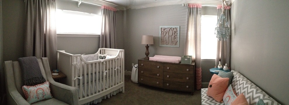 This is an example of a mid-sized transitional nursery for girls in New Orleans with grey walls, carpet and grey floor.