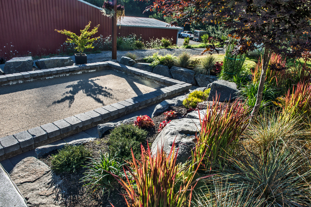 Design ideas for a large modern backyard full sun outdoor sport court for summer in Seattle with a fire feature and concrete pavers.