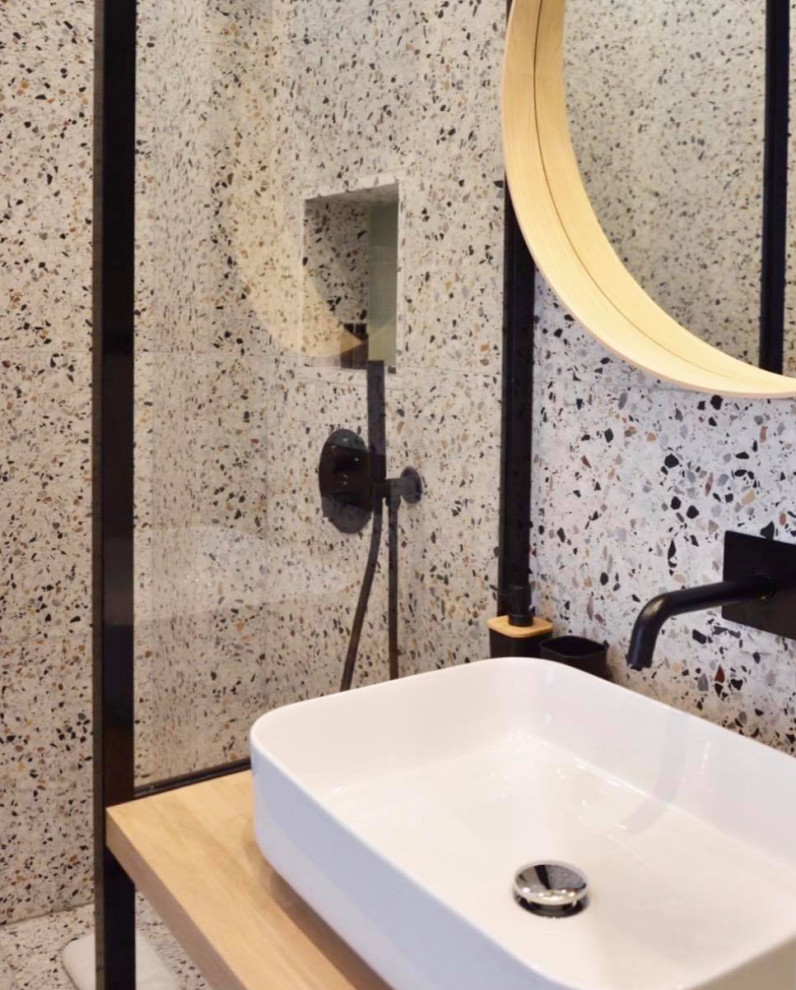 Photo of a small contemporary 3/4 bathroom in Paris with open cabinets, a curbless shower, white tile, gray tile, black tile, black and white tile, ceramic tile, white walls, light hardwood floors, a console sink, wood benchtops, beige floor, an open shower, beige benchtops and a single vanity.