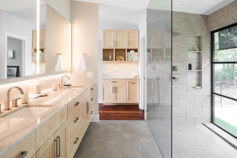 Inspiration for a contemporary master bathroom in Austin with light wood cabinets, gray tile, porcelain tile, porcelain floors, an undermount sink, quartzite benchtops, a curbless shower, an open shower and grey floor.