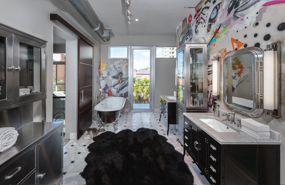 This is an example of a contemporary master bathroom in Miami with black cabinets, black and white tile, multi-coloured walls, marble floors, an undermount sink, marble benchtops and shaker cabinets.