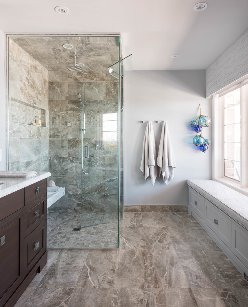 Large transitional master bathroom in Toronto with shaker cabinets, dark wood cabinets, marble benchtops, a curbless shower, gray tile, porcelain tile, grey walls and porcelain floors.