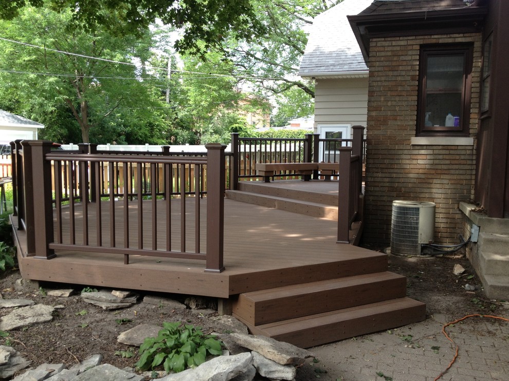 Mid-sized backyard deck photo with no cover
