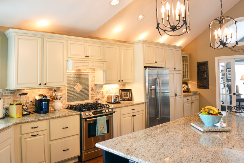This is an example of a mid-sized country kitchen in Raleigh.