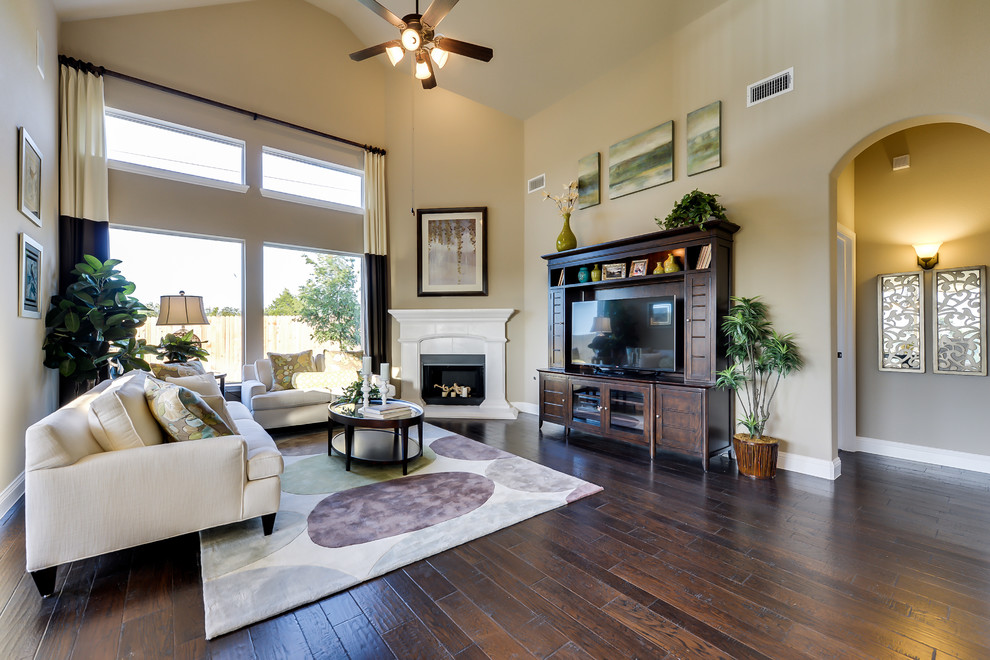 Photo of a contemporary open concept living room in Dallas with dark hardwood floors and a corner fireplace.