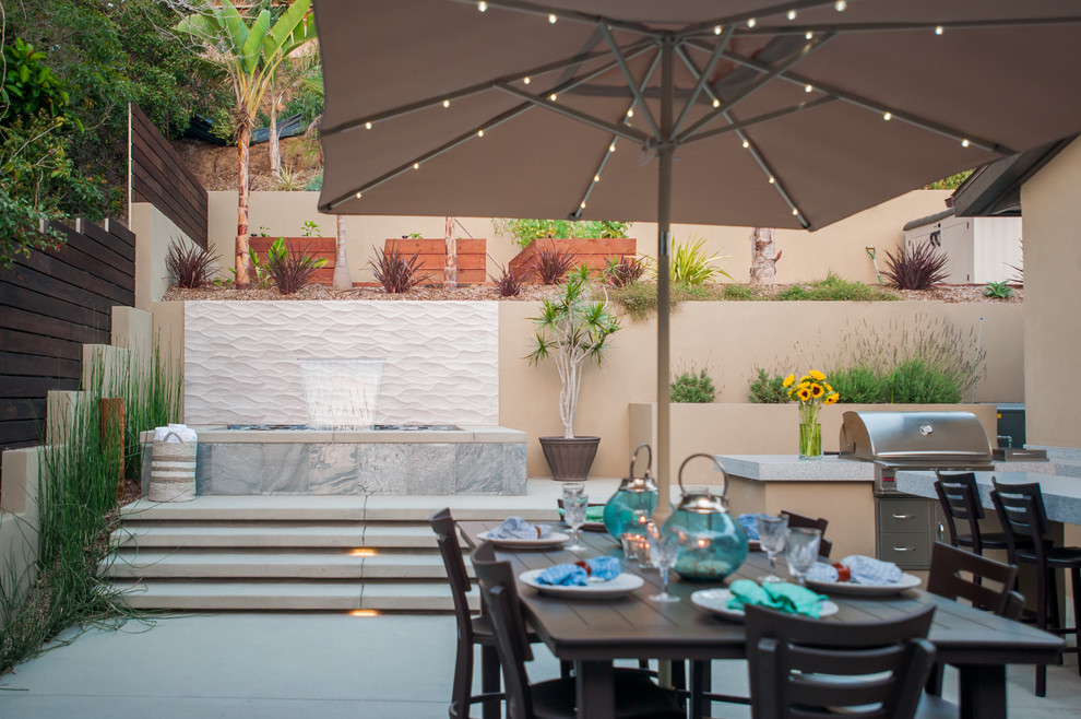 Design ideas for a large modern backyard patio in San Diego with concrete slab.
