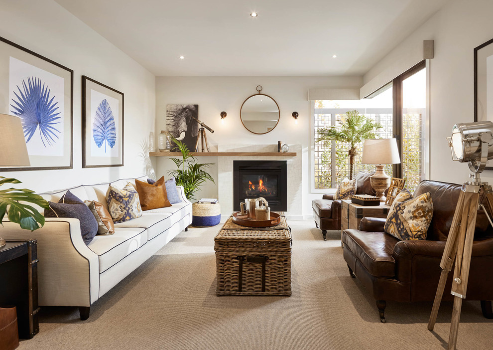 This is an example of a beach style enclosed living room in Melbourne with white walls, carpet, a standard fireplace and a stone fireplace surround.
