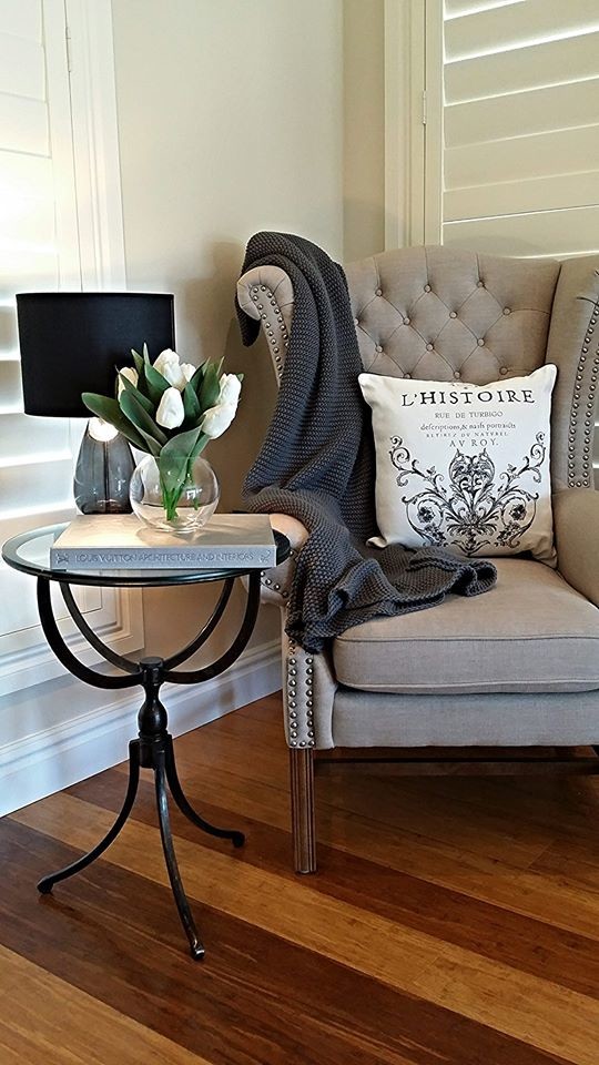 Design ideas for a small traditional open concept living room in Sydney with a library, beige walls, bamboo floors, no fireplace, a plaster fireplace surround and no tv.