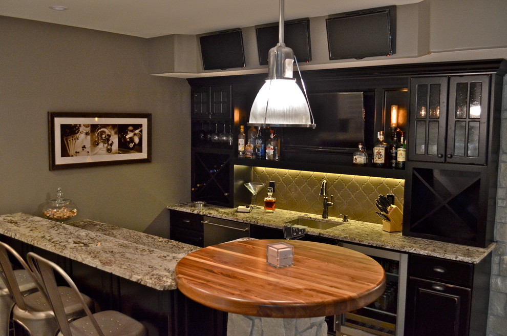 Home design - rustic ceramic tile home design idea in Omaha with an undermount sink, black cabinets, granite countertops and glass tile backsplash