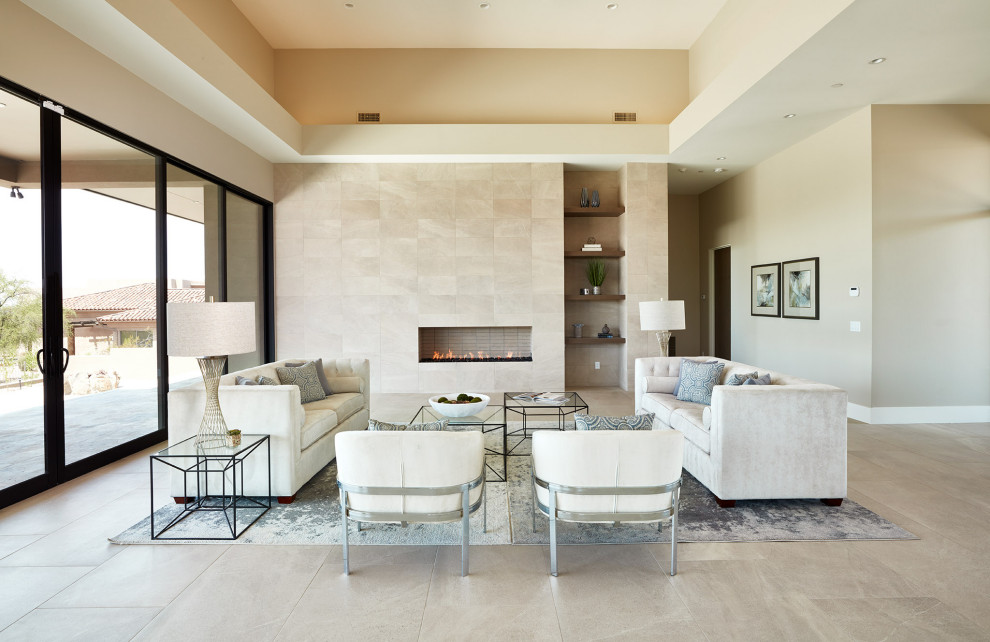 Photo of a large contemporary open concept living room in Phoenix with beige walls, ceramic floors, a ribbon fireplace, a tile fireplace surround, a wall-mounted tv and beige floor.