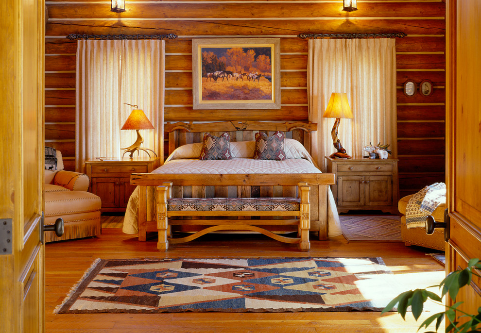 This is an example of a mid-sized country loft-style bedroom in Other with medium hardwood floors.
